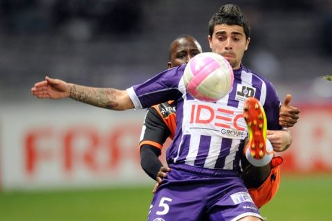 Toulouses's mildfielder Paulo Machado battles for the ball during the French L1 football match Toulouse vs Lorient, on March 10, 2012 in Toulouse, southwestern France. AFP PHOTO REMY GABALDA (Photo credit should read REMY GABALDA/AFP/Getty Images)