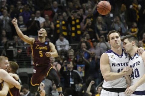 Kansas State's Mason Schoen, left, and Kade Kinnamon (40) leave the court after a regional final NCAA college basketball tournament game against Loyola-Chicago, Saturday, March 24, 2018, in Atlanta. Loyola-Chicago won 78-62. (AP Photo/John Amis)