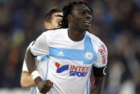 FILE- In this Wednesday, Feb. 8, 2017 file photo, Marseille's forward Bafetimbi Gomis celebrates after scoring during the League One soccer match between Marseille and Guingamp, at the Velodrome Stadium, in Marseille, southern France. Getting Marseille back into Europe is a crucial part of American owner Franck McCourts Champions Project  and his players can take a big step toward that with a good performance away to Bordeaux on Sunday, May 13, 2017. (AP Photo/Claude Paris, File)