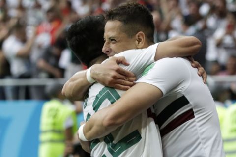 Mexico's Javier Hernandez, right, celebrates with teammate Hirving Lozano after scoring his side's second goal during the group F match between Mexico and South Korea at the 2018 soccer World Cup in the Rostov Arena in Rostov-on-Don, Russia, Saturday, June 23, 2018. (AP Photo/Lee Jin-man)