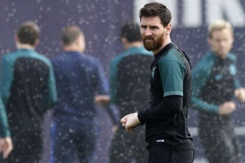 FC Barcelona's Lionel Messi looks on during a training session at the Sports Center FC Barcelona Joan Gamper in Sant Joan Despi, Spain, Tuesday, April 18, 2017. FC Barcelona will play against Juventus in a Champions League quarterfinal, second-leg soccer match on Wednesday .(AP Photo/Manu Fernandez)