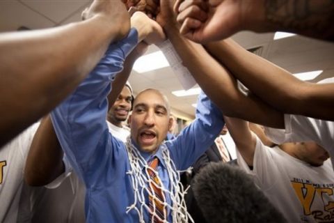 In this photo provided by Virginia Commonwealth, VCU head coach Shaka Smart celebrates with his team after winning the Southwest regional final game against Kansas in the NCAA college basketball tournament Sunday, March 27, 2011, in San Antonio. VCU won 71-61. (AP Photo/Virginia Commonwealth, Scott K. Brown) ** NO SALES **