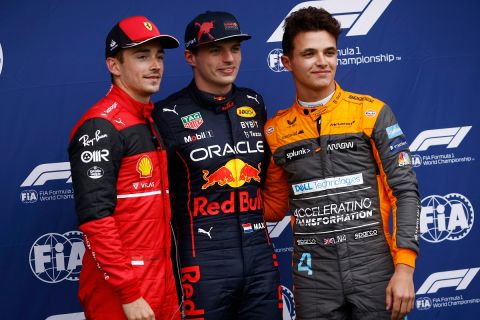 Red Bull driver Max Verstappen, center, of the Netherlands, smiles after clocking a fastest time with second fastest time Ferrari driver Charles Leclerc, left, of Monaco, and third fastest time Mclaren driver Lando Norris, of Britain, during the qualifying session for Sunday's Emilia Romagna Formula One Grand Prix, at the Dino and Enzo Ferrari racetrack in Imola, Italy, Friday, April 22, 2022. (Guglielmo Mangiapane, Pool via AP)