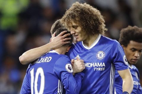 Chelsea's Eden Hazard, left, and teammate David Luiz celebrate after scoring during the English Premier League soccer match between Chelsea and Bournemouth at Stamford Bridge stadium in London, Monday, Dec. 26, 2016.(AP Photo/Frank Augstein)