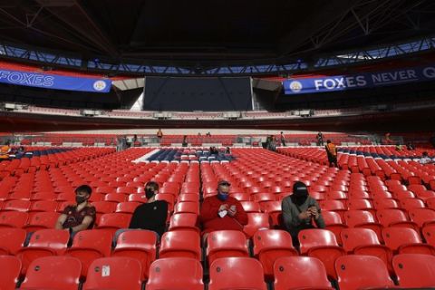 Fans wait in the stands ahead of the English FA Cup semifinal soccer match between Leicester City and Southampton at Wembley Stadium in London, Sunday, April 18, 2021. (Richard Heathcote/Pool via AP)