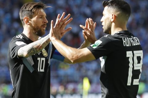 Argentina's Sergio Aguero, right, and Lionel Messi celebrate after scoring their side's first goal during the group D match between Argentina and Iceland at the 2018 soccer World Cup in the Spartak Stadium in Moscow, Russia, Saturday, June 16, 2018. (AP Photo/Victor Caivano)
