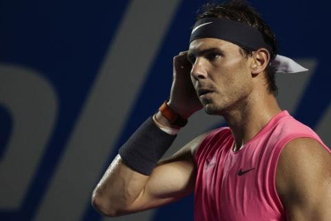 Spain's Rafael Nadal walks on the court in his men's final match against Taylor Fritz of the U.S. at the Mexican Tennis Open in Acapulco, Mexico, Saturday, Feb. 29, 2020. (AP Photo/Rebecca Blackwell)