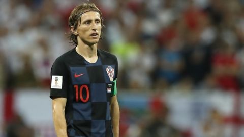 Croatia's Luka Modric walks on the pitch during the semifinal match between Croatia and England at the 2018 soccer World Cup in the Luzhniki Stadium in, Moscow, Russia, Wednesday, July 11, 2018. (AP Photo/Alastair Grant)