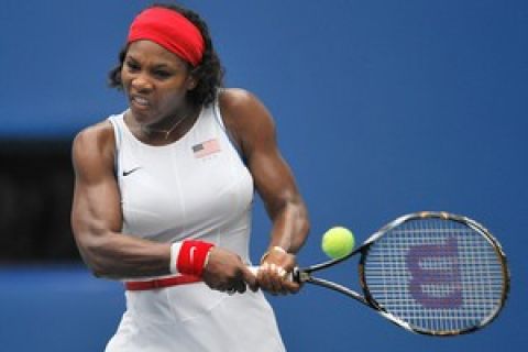 Serena Williams of US returns the ball to Olga Govortsova of Belarus during their 2008 Beijing Olympic Games tennis match at the Olympic Green tennis court in Beijing on August 10, 2008.      AFP PHOTO PHILIPPE HUGUEN (Photo credit should read PHILIPPE HUGUEN/AFP/Getty Images)