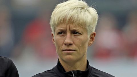 Seattle Reign forward Megan Rapinoe is shown during the national anthem before an NWSL soccer match against the Portland Thorns in Portland, Ore., Wednesday, July 22, 2015. (AP Photo/Don Ryan)