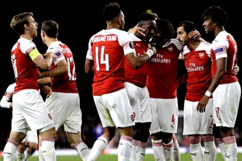 Arsenal's Danny Welbeck, center, is celebrated after scoring his side's second goal during the Europa League Group E soccer match between Arsenal and Vorskla in London, England, Thursday, Sept. 20, 2018. (AP Photo/Kirsty Wigglesworth)