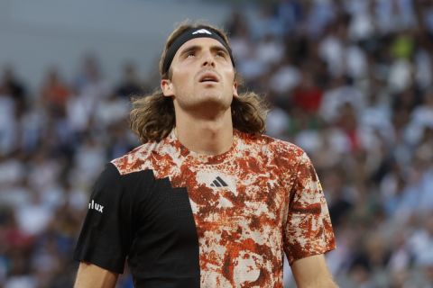 Greece's Stefanos Tsitsipas reacts after missing a shot against Spain's Carlos Alcaraz during their quarterfinal match of the French Open tennis tournament at the Roland Garros stadium in Paris, Tuesday, June 6, 2023. (AP Photo/Jean-Francois Badias)