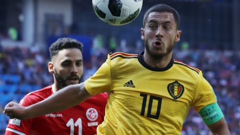 Belgium's Eden Hazard, right, and Tunisia's Dylan Bronn challenge for the ball during the group G match between Belgium and Tunisia at the 2018 soccer World Cup in the Spartak Stadium in Moscow, Russia, Saturday, June 23, 2018. (AP Photo/Hassan Ammar)