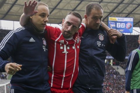 Bayern's  Franck Ribery center is helped after he got injured during the German Bundesliga soccer match between Hertha BSC Berlin and FC Bayern Munich in Berlin, Sunday, Oct. 1, 2017.   (Michael Kappeler/dpa via AP)