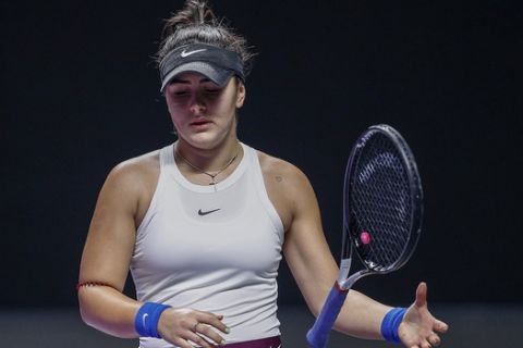 Bianca Andreescu of Canada reacts as she plays against Karolina Pliskova of the Czech Republic during the WTA Finals Tennis Tournament in Shenzhen, China's Guangdong province, Wednesday, Oct. 30, 2019. (AP Photo/Andy Wong)