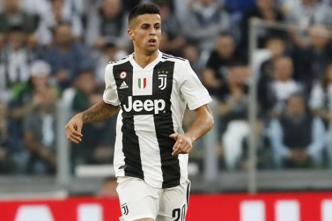 Juventus' Joao Cancelo controls the ball during the Serie A soccer match between Juventus and Genoa at the Allianz stadium, in Turin, Italy, Saturday, Oct. 20, 2018. (AP Photo/Antonio Calanni)