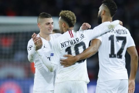 PSG forward Neymar, center, celebrates with midfielder Marco Verratti, left, and forward Eric Maxim Choupo-Moting at the end of a Champions League Group C soccer match between Paris Saint Germain and Liverpool at the Parc des Princes stadium in Paris, Wednesday, Nov. 28, 2018. (AP Photo/Francois Mori)