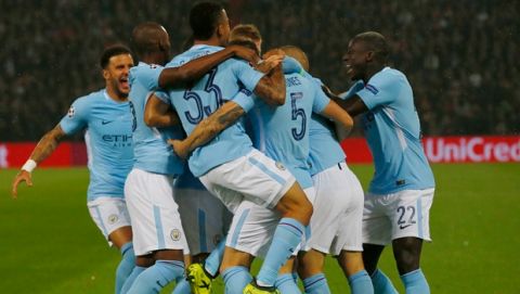 Manchester City players jubilate after scoring during a Champions League Group F soccer match between Feyenoord and Manchester City at the Kuip stadium in Rotterdam, Netherlands, Wednesday, Sept. 13, 2017. (AP Photo/Peter Dejong)