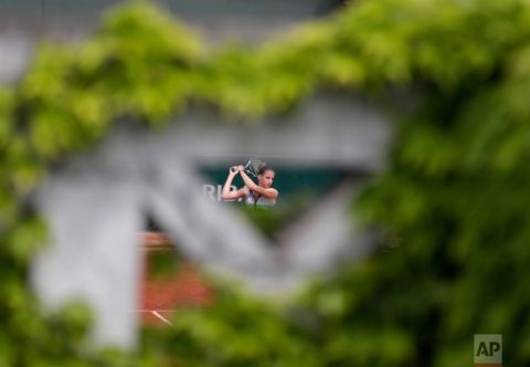 In this Sunday, June 4, 2017 photo, Karolina Pliskova of the Czech Republic returns the ball to Germany's Carina Witthoeft during their third round match of the French Open tennis tournament at the Roland Garros stadium in Paris. (AP Photo/Petr David Josek)