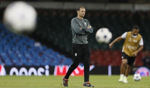 Juventus head coach Massimiliano Allegri watches his players during a training session at the Millennium Stadium in Cardiff, Wales Friday June 2, 2017. Real Madrid will play Juventus in the final of the Champions League soccer match in Cardiff on Saturday. (AP Photo/Kirsty Wigglesworth)