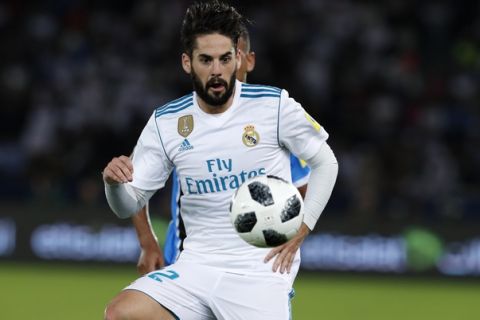 Real Madrid's Isco eyes the ball during the Club World Cup final soccer match between Real Madrid and Gremio at Zayed Sports City stadium in Abu Dhabi, United Arab Emirates, Saturday, Dec. 16, 2017. (AP Photo/Hassan Ammar)