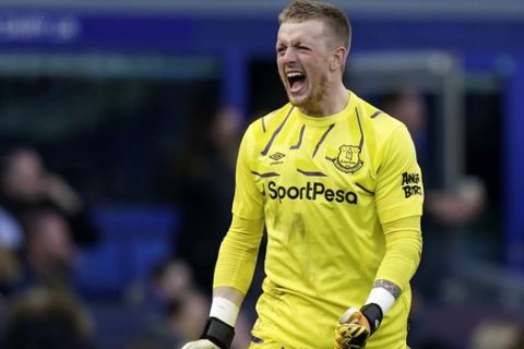 Everton's goalkeeper Jordan Pickford reacts after teammate Dominic Calvert-Lewin scored a goal that was laster disallowed during the English Premier League soccer match between Everton and Manchester United at Goodison Park in Liverpool, England, Sunday, March 1, 2020. (AP Photo/Jon Super)
