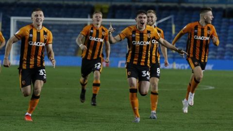 Hull's players run to celebrate after their winning penalty following the penalty shootout, during the English League Cup soccer match between Leeds United and Hull in Leeds, England, Wednesday, Sept. 16, 2020. (Phil Noble/Pool via AP)