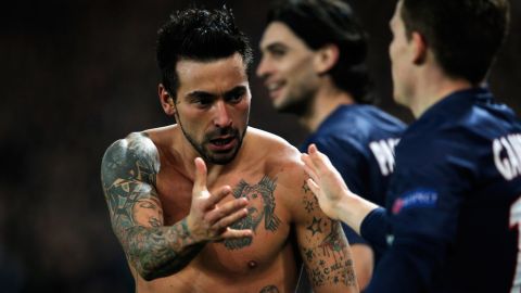 PARIS, FRANCE - MARCH 06:  Ezequiel Lavezzi of PSG takes off his shirt and celebrates with team mates after he scores his team first goal during the Round of 16 UEFA Champions League match between Paris St Germain and Valencia CF at Parc des Princes on March 6, 2013 in Paris, France.  (Photo by Dean Mouhtaropoulos/Getty Images)