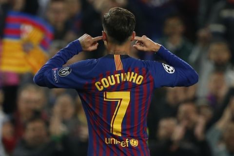 Barcelona forward Philippe Coutinho gestures after scoring his side's third goal during the Champions League quarterfinal, second leg, soccer match between FC Barcelona and Manchester United at the Camp Nou stadium in Barcelona, Spain, Tuesday, April 16, 2019. (AP Photo/Joan Monfort)