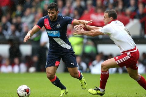 SHEFFIELD, ENGLAND - JULY 26:  Mehdi Abeid of Newcastle United holds off James Wallace of  Sheffield United during the pre season friendly match between Sheffield United and Newcastle United at Bramall Lane on July 26, 2015 in Sheffield, England.  (Photo by Jan Kruger/Getty Images)
