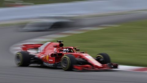 Ferrari driver Sebastian Vettel of Germany steers his car during the Spanish Formula One Grand Prix at the Barcelona Catalunya racetrack in Montmelo, Spain, Sunday, May 13, 2018. (AP Photo/Emilio Morenatti)