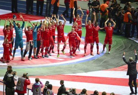 Bayern Munich's head coach Jupp Heynckes (R) celebrates in front of his players after they won the final football match of the German Cup (DFB - Pokal) FC Bayern Munich vs VfB Stuttgart on June 1, 2013 at the Olympic Stadium in Berlin. Champions League winners Bayern Munich became the first Bundesliga champion to win the treble after their hard-earned 3-2 win over plucky VfB Stuttgart in Saturday's German Cup final.
AFP PHOTO / JOHN MACDOUGALL

RESTRICTIONS / EMBARGO - DFL LIMITS THE USE OF IMAGES ON THE INTERNET TO 15 PICTURES (NO VIDEO-LIKE SEQUENCES) DURING THE MATCH AND PROHIBITS MOBILE (MMS) USE DURING AND FOR FURTHER TWO HOURS AFTER THE MATCH. FOR MORE INFORMATION CONTACT DFL        (Photo credit should read JOHN MACDOUGALL/AFP/Getty Images)