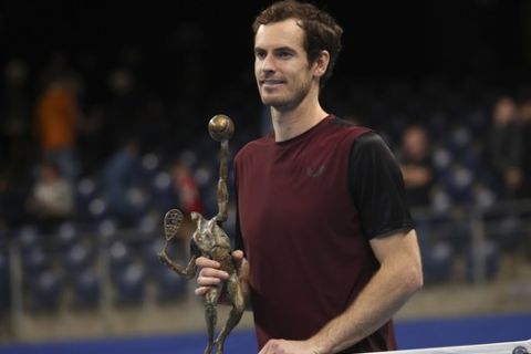 Andy Murray of Britain poses with the trophy after winning the European Open final tennis match in Antwerp, Belgium, Sunday, Oct. 20, 2019. Murray defeated Stan Wawrinka of Switzerland 3-6/6-4/6-4. (AP Photo/Francisco Seco)