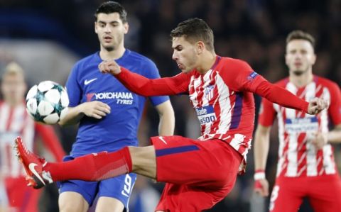 Atletico's Lucas, right, and Chelsea's Alvaro Morata, left, vie for the ball during the Champions League Group C soccer match between Chelsea and Atletico Madrid at Stamford Bridge stadium in London Tuesday, Dec. 5, 2017. (AP Photo/Frank Augstein)