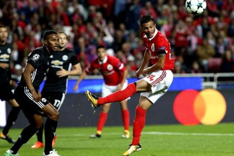 Benfica's Diogo Goncalves, right, jumps for the ball by Manchester United's Chris Smalling during their Champions League group A soccer match between Manchester United and Benfica at Benfica's Luz stadium in Lisbon, Wednesday, Oct. 18, 2017. (AP Photo/Armando Franca)