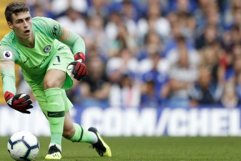 Chelsea goalkeeper Kepa Arrizabalaga gives the ball during the English Premier League soccer match between Chelsea and Arsenal at Stamford bridge stadium in London, Saturday, Aug. 18, 2018. (AP Photo/Alastair Grant)