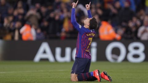 FC Barcelona's Coutinho celebrates after scoring during a Spanish Copa del Rey soccer match between FC Barcelona and Sevilla at the Camp Nou stadium in Barcelona, Spain, Wednesday, Jan. 30, 2019. (AP Photo/Manu Fernandez)