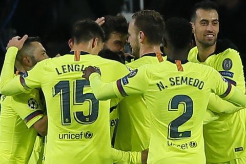 Barcelona players celebrate scoring 2-0 during a Group B Champions League soccer match between PSV Eindhoven and Barcelona at the Philips stadium in Eindhoven, Netherlands, Wednesday, Nov. 28, 2018. (AP Photo/Peter Dejong)