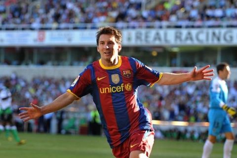 SANTANDER, SPAIN - AUGUST 29: Leo Messi of Barcelona celebrates after scoring Barcelona's first goal during the La Liga match between Racing Santander and Barcelona at El Sardinero stadium on August 29, 2010 in Santander, Spain.  (Photo by Denis Doyle/Getty Images)