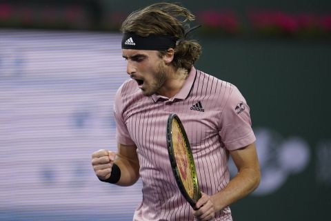 Stefanos Tsitsipas, of Greece, reacts to winning a point against Jack Sock at the BNP Paribas Open tennis tournament Saturday, March 12, 2022, in Indian Wells, Calif. (AP Photo/Marcio Jose Sanchez)