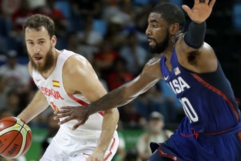 Spain's Sergio Rodriguez, left, drives up court past United States' Kyrie Irving, right, during a semifinal round basketball game at the 2016 Summer Olympics in Rio de Janeiro, Brazil, Friday, Aug. 19, 2016. (AP Photo/Charlie Neibergall)