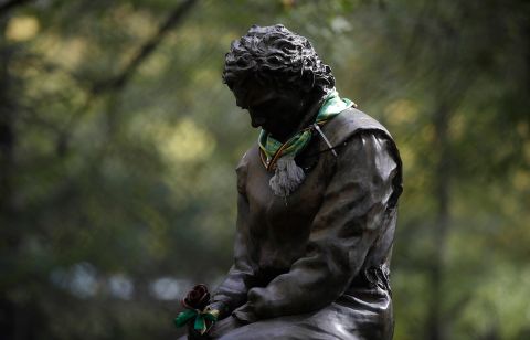A scarf has been placed on a statue of Brazilian race car driver Ayrton Senna ahead of Sunday's Emilia Romagna Formula One Grand Prix, at the Dino and Enzo Ferrari racetrack, in Imola, Italy, Friday, Oct. 30, 2020. Brazilian Formula One driver Ayrton Senna was killed on May 1, 1994 after his car crashed into a concrete barrier at the Autodromo Enzo e Dino Ferrari in Italy. (AP Photo/Luca Bruno)
