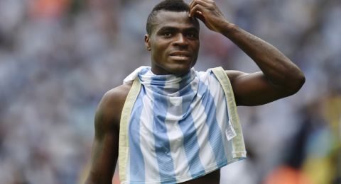 Nigeria's Emmanuel Emenike walks off the pitch with an Argentina jersey during the group F World Cup soccer match between Nigeria and Argentina at the Estadio Beira-Rio in Porto Alegre, Brazil, Wednesday, June 25, 2014. (AP Photo/Martin Meissner)