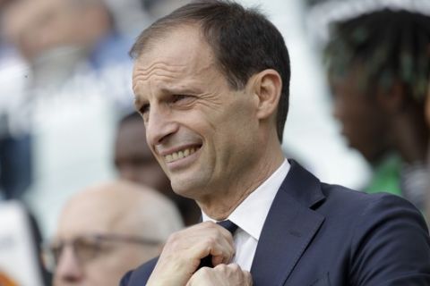 Juventus coach Massimiliano Allegri adjusts his tie prior to the start of a Serie A soccer match between Juventus and AC Fiorentina, at the Allianz stadium in Turin, Italy, Saturday, April 20, 2019. Juventus needs a draw against visiting Fiorentina to clinch a record-extending eighth straight Serie A title. (AP Photo/Luca Bruno)