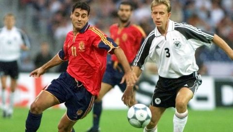 German Joerg Heinrich, right and Spanish Dani Garcia fight for the control of the ball during a friendly soccer fmatch Germany vs Spain in the Niedersachsen stadium of Hanover, Lower Saxony on late Wednesday, August 16, 2000. (AP Photo/Christof Stache)