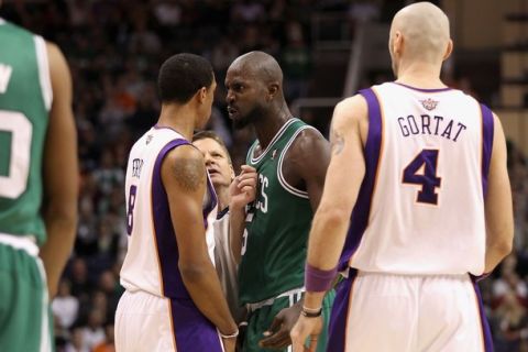 PHOENIX, AZ - JANUARY 28:  Kevin Garnett #5 of the Boston Celtics stares down Channing Frye #8 of the Phoenix Suns after Garnett was called for a technical foul during the NBA game at US Airways Center on January 28, 2011 in Phoenix, Arizona.  The Suns defeated the Celtics 88-71. NOTE TO USER: User expressly acknowledges and agrees that, by downloading and or using this photograph, User is consenting to the terms and conditions of the Getty Images License Agreement.  (Photo by Christian Petersen/Getty Images)