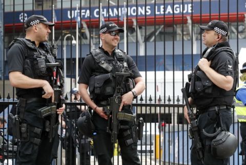Armed police officers stand guard ahead of the Champions League final soccer match between Juventus and Real Madrid at the Millennium stadium in Cardiff, Wales Saturday June 3, 2017. (AP Photo/Frank Augstein)