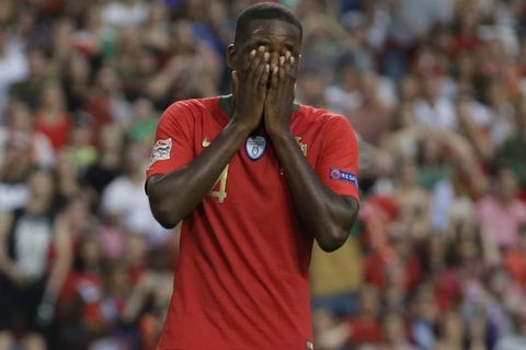 Portugal's William Carvalho reacts during the UEFA Nations League soccer match between Portugal and Italy at the Luz stadium in Lisbon, Monday, Sept. 10, 2018. (AP Photo/Armando Franca)