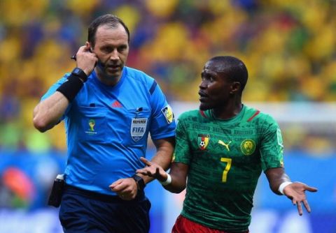 BRASILIA, BRAZIL - JUNE 23: Landry N'Guemo of Cameroon appeals to referee Jonas Eriksson during the 2014 FIFA World Cup Brazil Group A match between Cameroon and Brazil at Estadio Nacional on June 23, 2014 in Brasilia, Brazil.  (Photo by Stu Forster/Getty Images)
