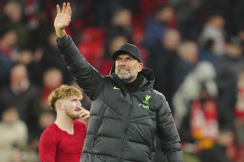 Liverpool's manager Jurgen Klopp waves to supporters at the end of the English Premier League soccer match between Liverpool and Chelsea, at Anfield Stadium, Liverpool, England, Wednesday, Jan.31, 2024. (AP Photo/Jon Super)